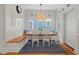 Bright breakfast nook with a charming built-in bench and large windows at 2416 W Club Blvd, Durham, NC 27705