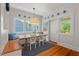 Cozy breakfast nook features a built-in bench, wood table, and great natural light at 2416 W Club Blvd, Durham, NC 27705