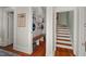 Mud room with built-in storage cabinets and bench, leading to a staircase at 2416 W Club Blvd, Durham, NC 27705