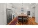 Spacious kitchen with stainless steel appliances, white cabinets, and large wooden island with seating at 2416 W Club Blvd, Durham, NC 27705