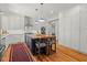 Bright kitchen featuring a central island with butcher block top, white cabinets, and modern appliances at 2416 W Club Blvd, Durham, NC 27705
