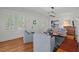 Bright and airy living room featuring plantation shutters, hardwood floors, and a cozy seating arrangement at 2416 W Club Blvd, Durham, NC 27705