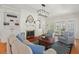 Bright living room with fireplace, built-in bookshelves, hardwood floors, and sophisticated decor at 2416 W Club Blvd, Durham, NC 27705
