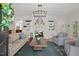 Bright living room with fireplace, built-in bookshelves, hardwood floors, and sophisticated decor at 2416 W Club Blvd, Durham, NC 27705