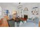 Bright living room with fireplace, built-in bookshelves, hardwood floors, and sophisticated decor at 2416 W Club Blvd, Durham, NC 27705