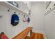 Mudroom features custom shelving, hooks, and a built-in wooden bench, perfect for organization and storage at 2416 W Club Blvd, Durham, NC 27705