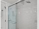 Modern walk-in shower with subway tile surround and glass door at 2416 W Club Blvd, Durham, NC 27705