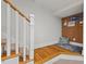 Cozy staircase landing with a built-in bench and wood flooring at 2416 W Club Blvd, Durham, NC 27705