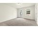 Bedroom with neutral carpet, a glass door to the porch, and bright, natural light at 25 Long Needle Ct # 37, Youngsville, NC 27596