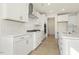 Modern kitchen with white cabinets, quartz countertops, stainless steel appliances, and stylish backsplash at 25 Long Needle Ct # 37, Youngsville, NC 27596
