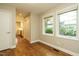 Bedroom with hardwood floors, neutral walls, and natural light at 2916 Rue Sans Famille, Raleigh, NC 27607