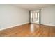 Bedroom with wood floors and glass patio doors with curtains for natural light at 2916 Rue Sans Famille, Raleigh, NC 27607