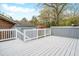 Spacious deck area with white wooden railings and an adjacent brick building at 2916 Rue Sans Famille, Raleigh, NC 27607