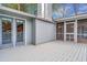 An outdoor deck featuring white wooden floors and a large opening into the screened porch at 2916 Rue Sans Famille, Raleigh, NC 27607