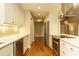 Spacious kitchen with stainless steel appliances and long sight lines to living room at 2916 Rue Sans Famille, Raleigh, NC 27607
