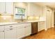 Kitchen with stainless steel appliances, subway tile backsplash, and white cabinetry at 2916 Rue Sans Famille, Raleigh, NC 27607