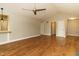 Open living room with hardwood floors, vaulted ceilings, and neutral paint at 2916 Rue Sans Famille, Raleigh, NC 27607