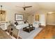 Open-concept living room flows into dining area with vaulted ceilings and hardwood floors at 2916 Rue Sans Famille, Raleigh, NC 27607