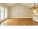 Bright living room with vaulted ceilings and French doors leading to balcony at 2916 Rue Sans Famille, Raleigh, NC 27607