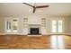 Spacious living room with hardwood floors, built in shelves, and fireplace at 2916 Rue Sans Famille, Raleigh, NC 27607