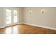 Sun room with double doors leading to balcony and hardwood flooring at 2916 Rue Sans Famille, Raleigh, NC 27607