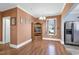 Dining room with hardwood floors, natural light, and an elegant display cabinet at 303 E J St, Erwin, NC 28339
