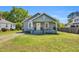 Charming one-story home with a cozy front porch, swing, and well-manicured lawn in a quiet neighborhood at 303 E J St, Erwin, NC 28339