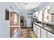 Well-lit kitchen featuring modern appliances, neutral cabinetry, and a double basin sink at 303 E J St, Erwin, NC 28339
