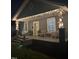 Charming front porch with string lights and outdoor seating at 303 E J St, Erwin, NC 28339