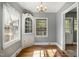 Cozy dining room featuring a classic corner cabinet and hardwood floors, adjacent to an entry way at 312 Greenwood Dr, Durham, NC 27704