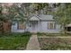 Charming single-story home with a well-maintained lawn and classic architectural details at 312 Greenwood Dr, Durham, NC 27704