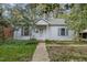 Charming single-story home with a well-maintained lawn and classic architectural details at 312 Greenwood Dr, Durham, NC 27704