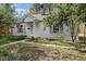 Charming single-story home with a well-maintained lawn and classic architectural details at 312 Greenwood Dr, Durham, NC 27704