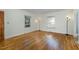 Spacious living room with hardwood floors and natural light, featuring neutral walls at 312 Greenwood Dr, Durham, NC 27704