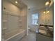 Functional bathroom with double sink, tub, and ample natural light at 316 Catheys Creek Cir, Wendell, NC 27591