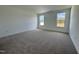 Bright and airy bedroom with neutral carpet, large windows, and views of the outdoors at 316 Catheys Creek Cir, Wendell, NC 27591