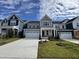 Charming two-story home showcasing a well-manicured lawn and a neatly paved driveway at 316 Catheys Creek Cir, Wendell, NC 27591