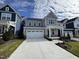Beautiful two-story home with a manicured lawn, and a spacious, well-maintained driveway at 316 Catheys Creek Cir, Wendell, NC 27591