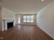 Bright living room with fireplace, wood floors and lots of natural light at 316 Catheys Creek Cir, Wendell, NC 27591