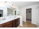 Bright bathroom features double sinks, white countertops, and ample storage space at 317 City Center Ln, Wendell, NC 27591