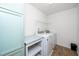 Efficient laundry room with washer, dryer, and storage providing convenience and organization at 317 City Center Ln, Wendell, NC 27591