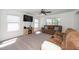 Inviting living room with a cozy fireplace, carpeted floors, and natural light at 317 City Center Ln, Wendell, NC 27591