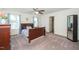 Spacious main bedroom featuring carpeted floors, ample natural light, and a ceiling fan at 317 City Center Ln, Wendell, NC 27591
