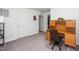 Carpeted home office with desk, chair, and natural light is perfect for work or study at 317 City Center Ln, Wendell, NC 27591