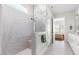 Spacious bathroom boasts a glass shower with neutral tilework, plus access to bedroom at 330 Middleton Pl, Chapel Hill, NC 27516