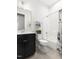 Clean bathroom with black vanity, toilet and shower/bath featuring decorative curtain at 330 Middleton Pl, Chapel Hill, NC 27516