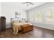 Well lit bedroom with wood floors and light colored walls at 330 Middleton Pl, Chapel Hill, NC 27516