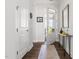 Bright entryway with hardwood floors, white walls, an open door and stylish decor at 330 Middleton Pl, Chapel Hill, NC 27516