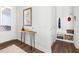 Entryway featuring wood console table with decorations and coat rack with storage at 330 Middleton Pl, Chapel Hill, NC 27516