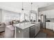 Open kitchen with island, stainless appliances, and eat-in dining area at 330 Middleton Pl, Chapel Hill, NC 27516